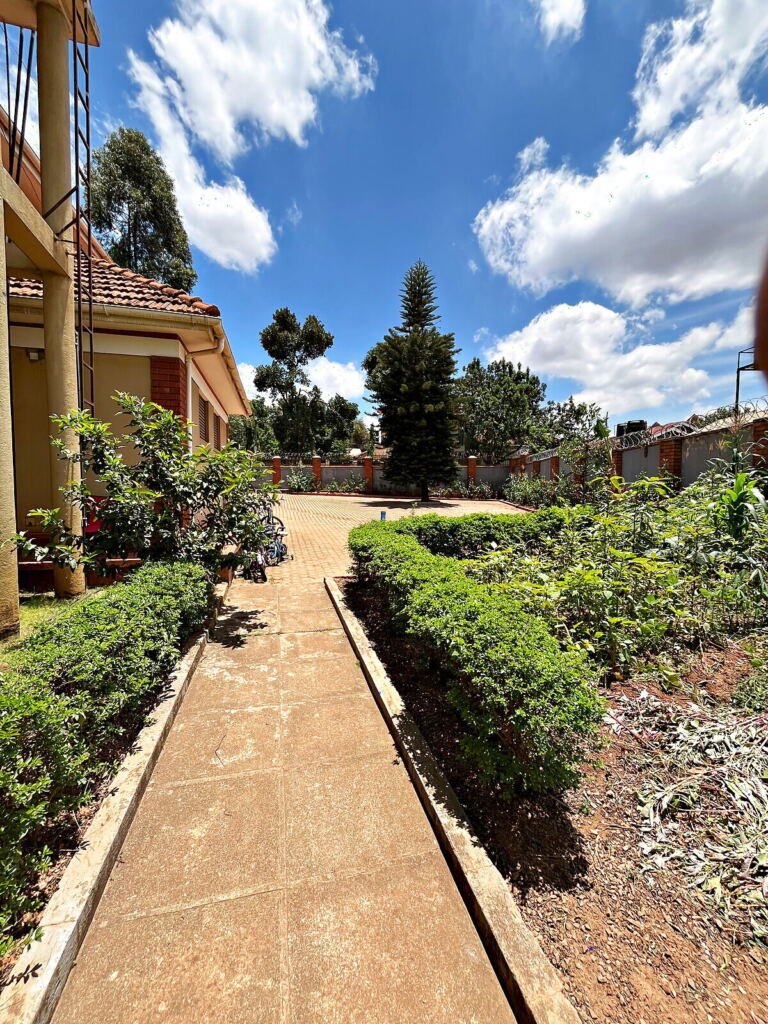 Five bedroom house for sale in Kiwatule, Ntinda: side path through the garden