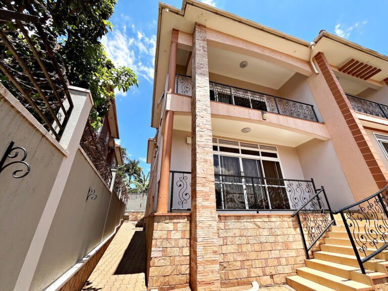 Five bedroom house for sale in Naalya: front balcony and stone pillars