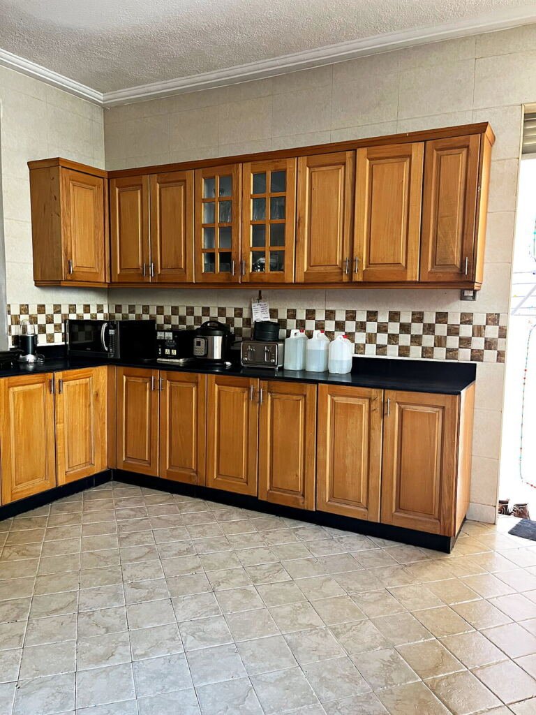Five bedroom house for sale in Naalya: fitted kitchen with timber cabinets